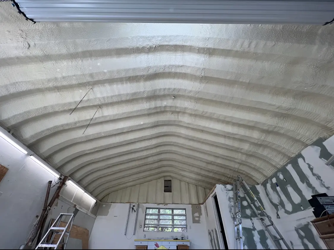 Spray polyurethane foam applied to the underside of a metal roof deck in Garden City